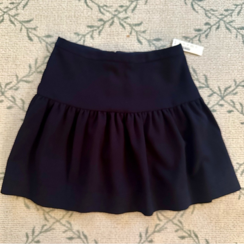 J.Crew drop-waist flounce mini skirt in navy blue. Size 0. Polyester. Lined. New
